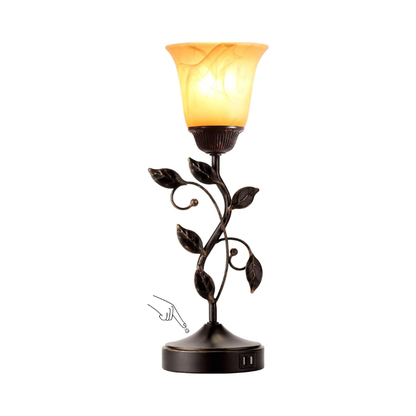 Table lamp with an amber shade and USB port
