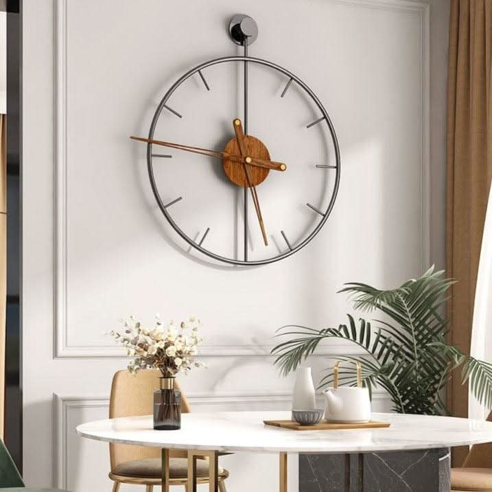 Wall clock with a linear metal frame