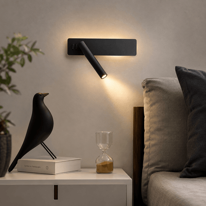 LED wall light with a swiveling lamp