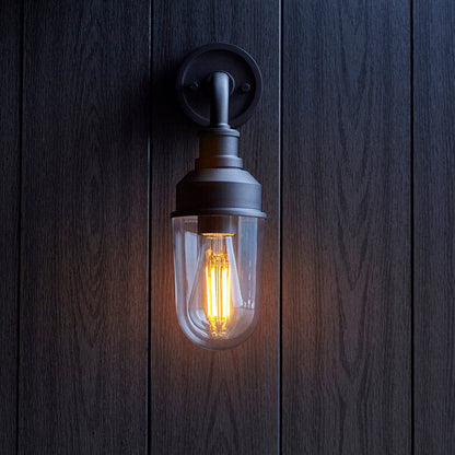 Glass wall light with a metal bracket
