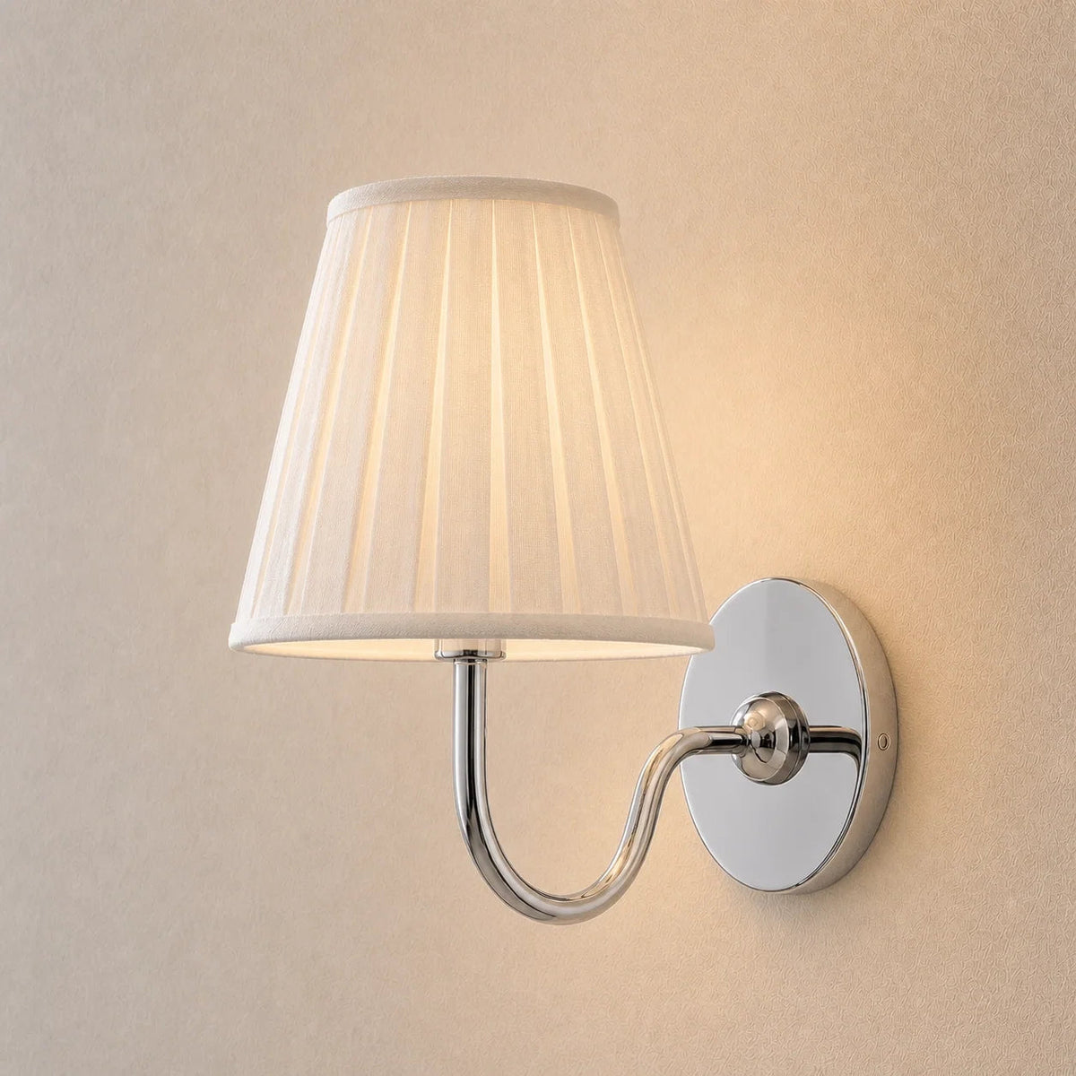 Wall lamp with a pleated shade
