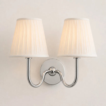 Wall lamp with a pleated shade