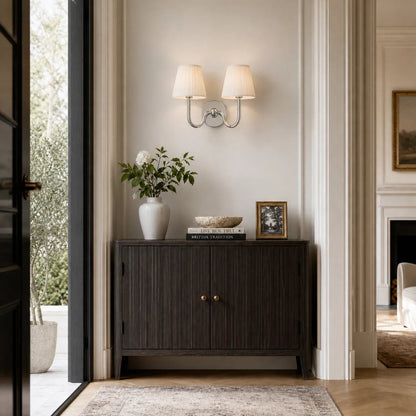 Wall lamp with a pleated shade