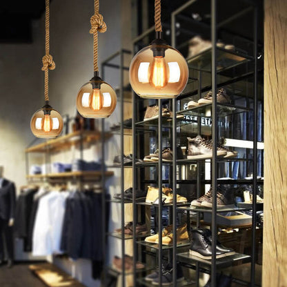 Lampe suspendue en forme de boule en verre
