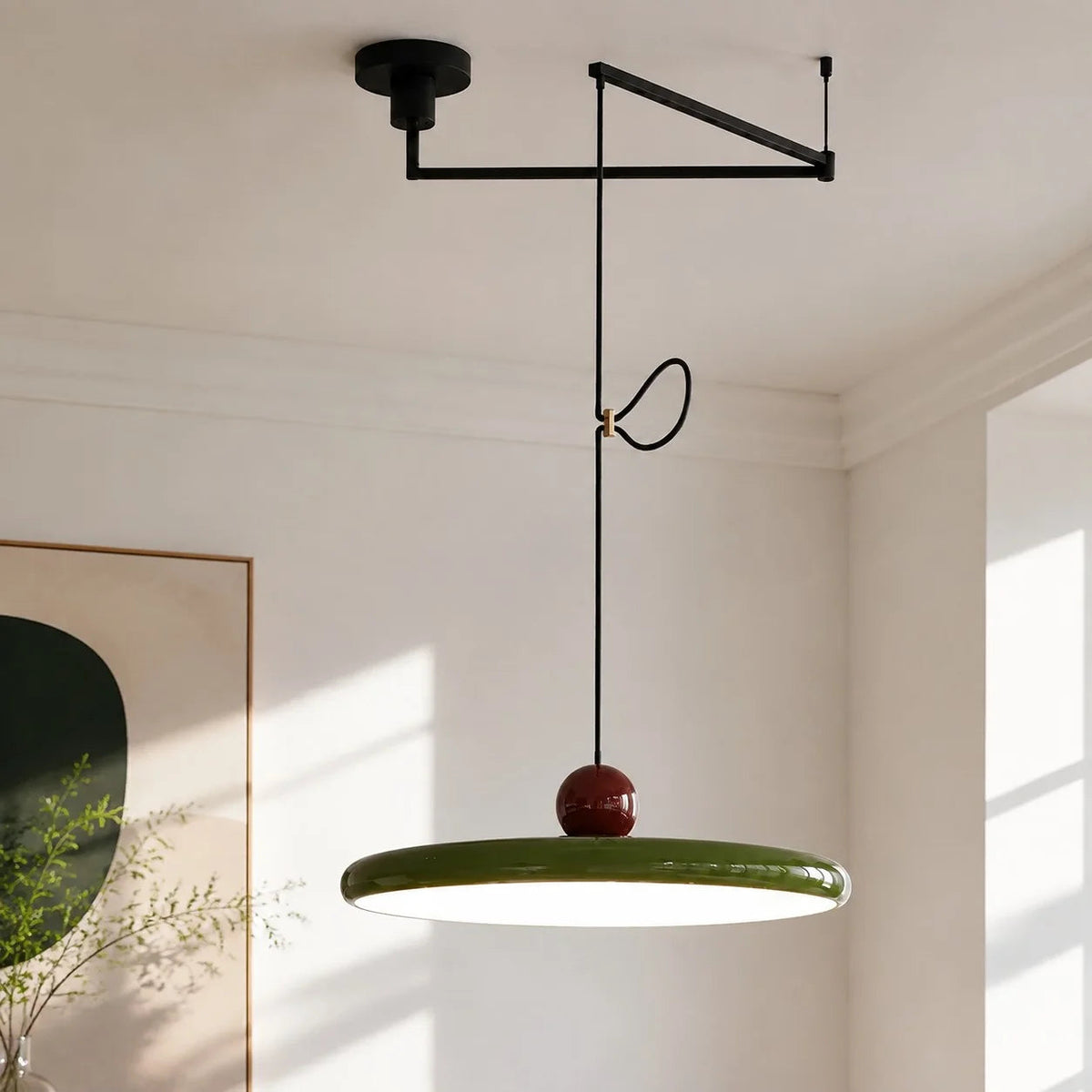 Pendant light with a shade and counterweight