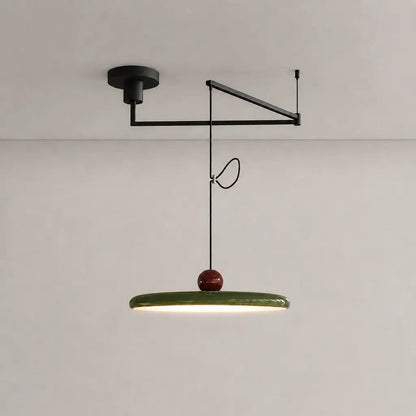 Pendant light with a shade and counterweight