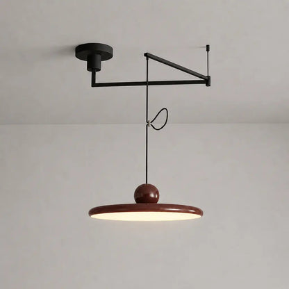 Pendant light with a shade and counterweight