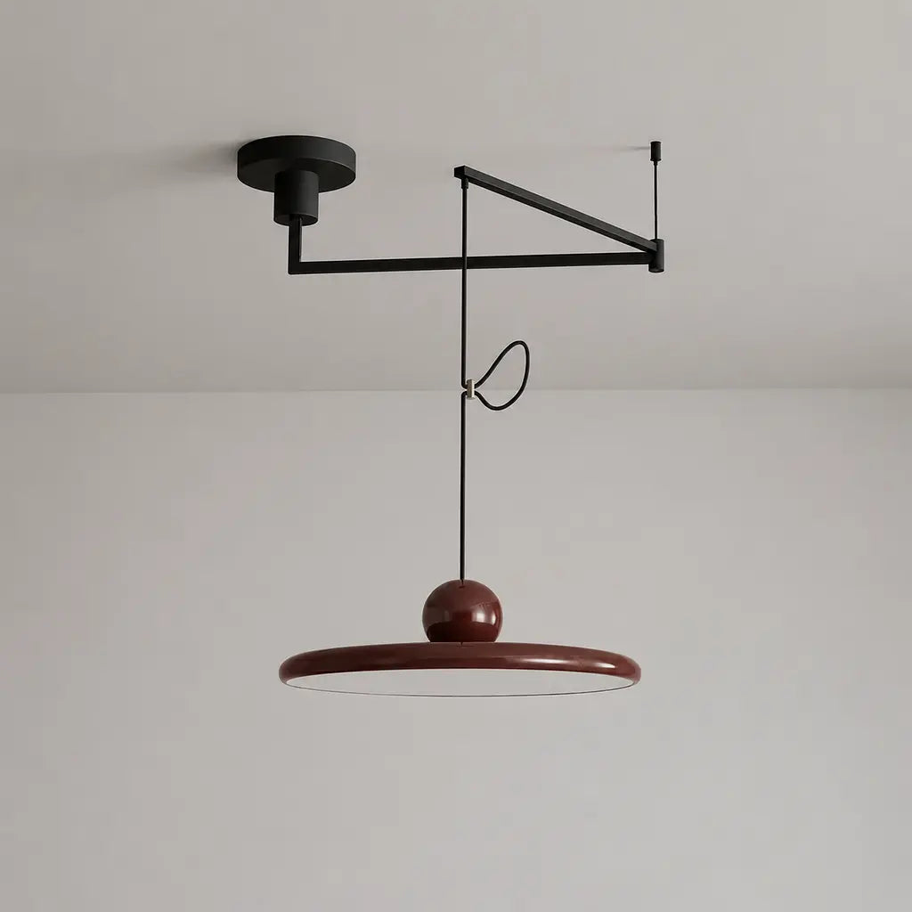 Pendant light with a shade and counterweight