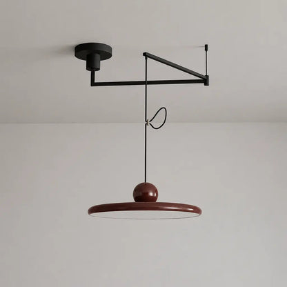 Pendant light with a shade and counterweight