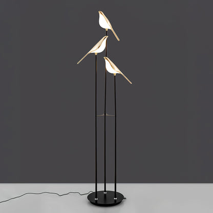 Floor lamp with a bird motif