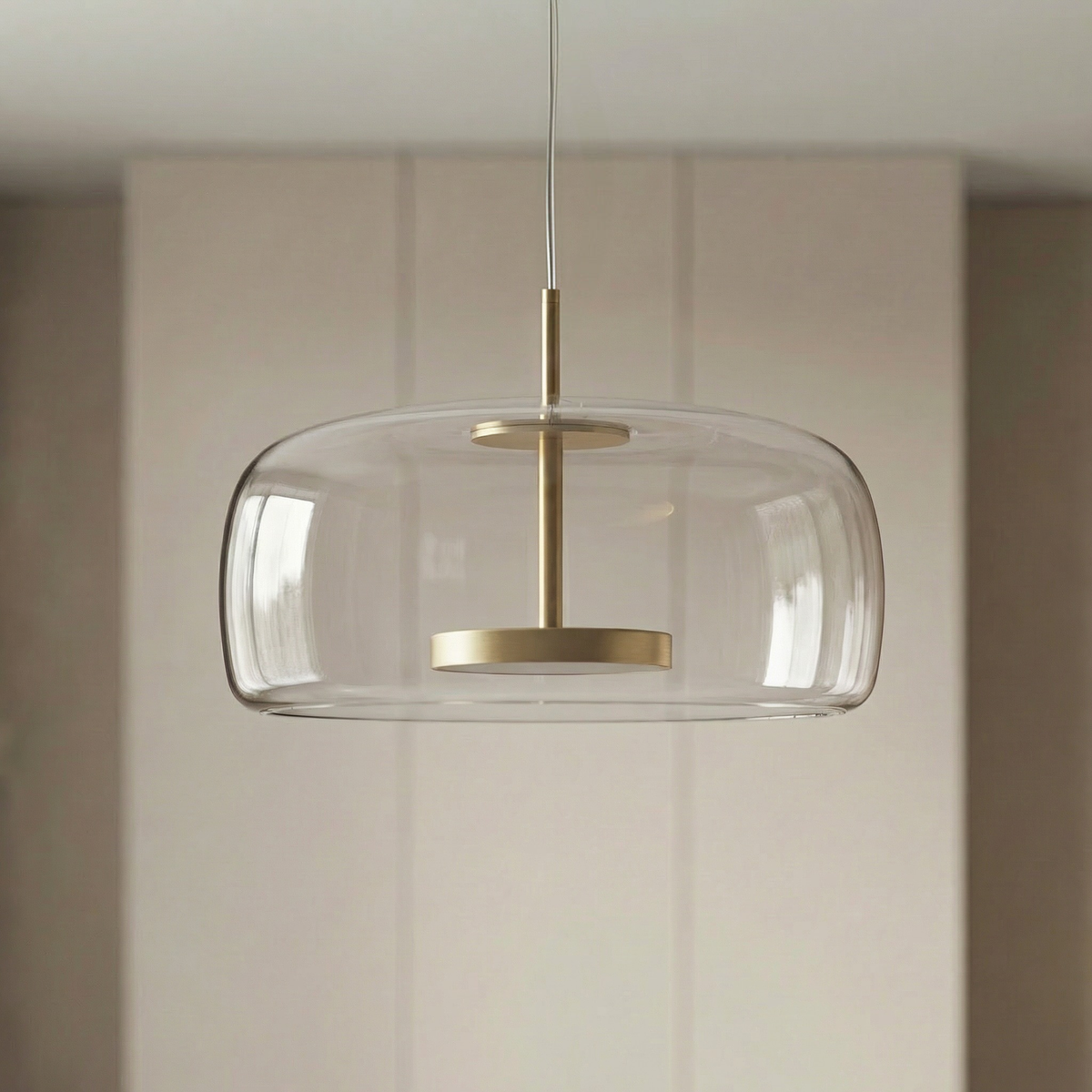 Glass pendant lamp with a shade