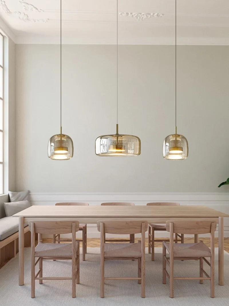 Glass pendant lamp with a shade