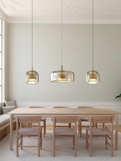 Glass pendant lamp with a shade