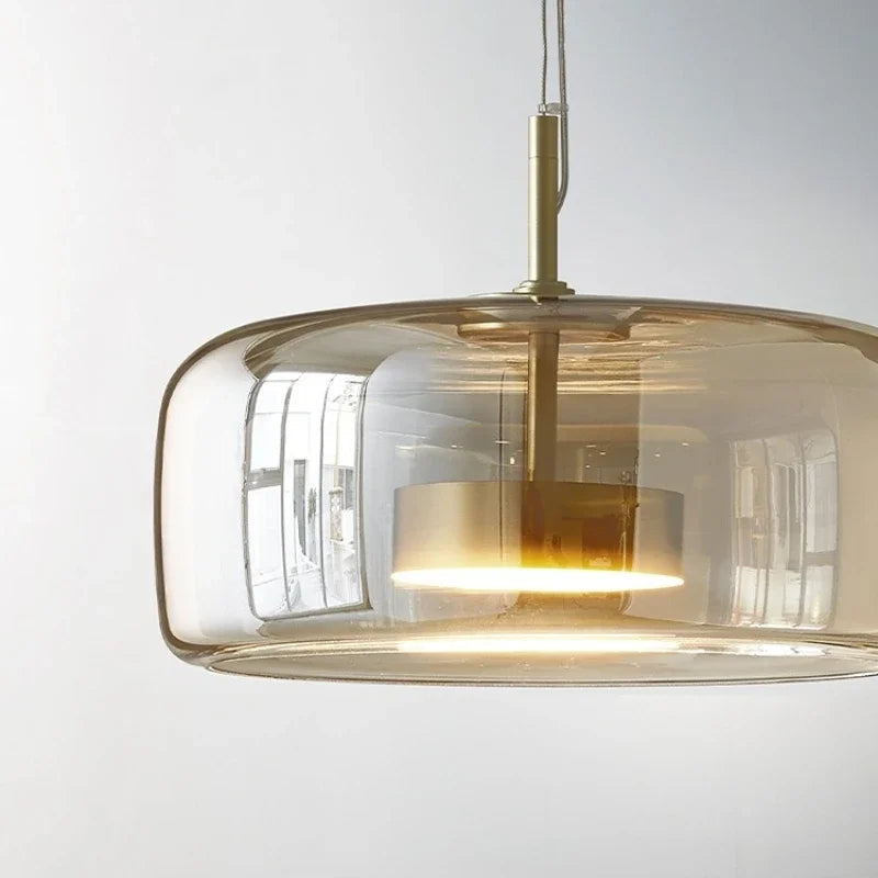 Glass pendant lamp with a shade